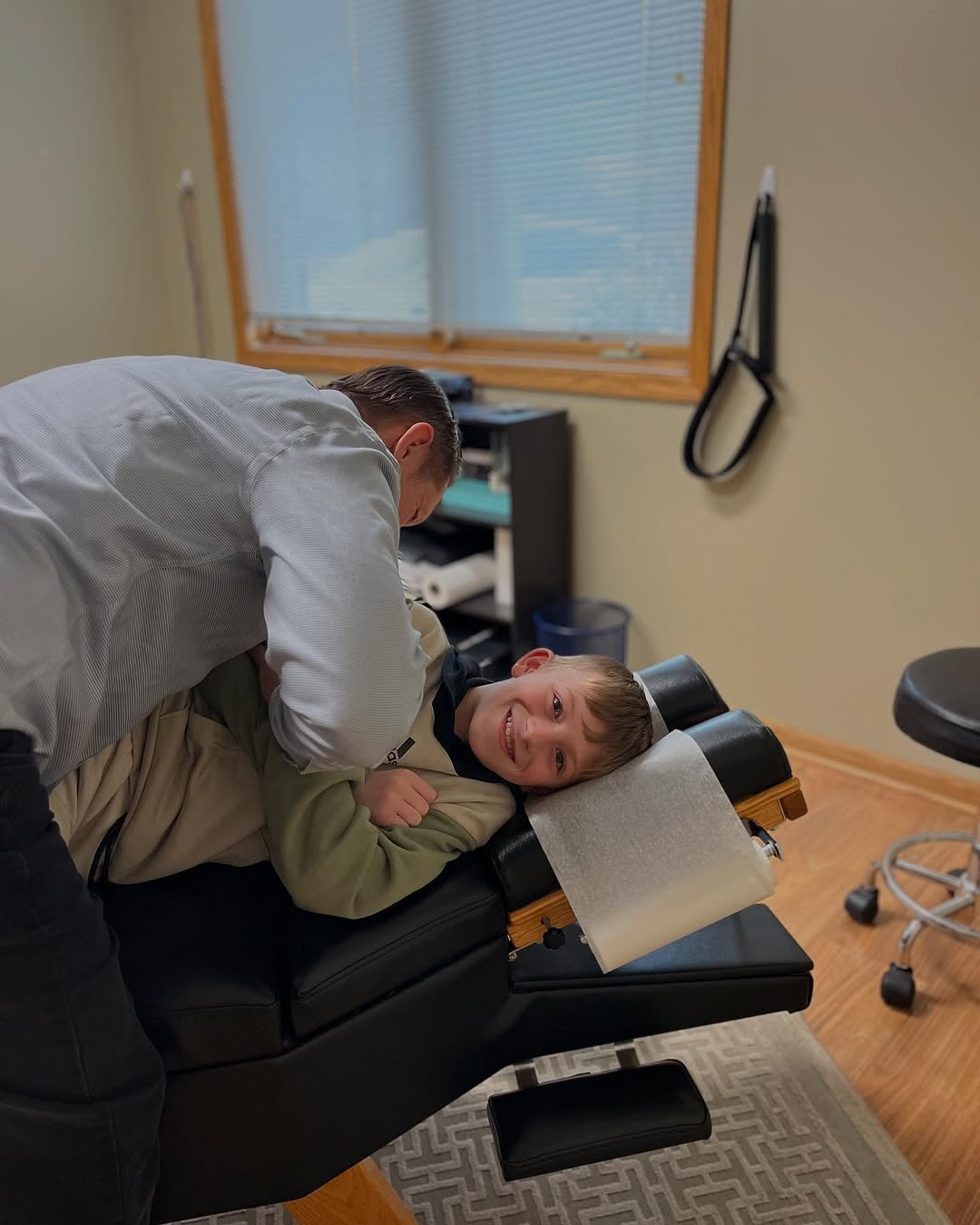 Dr. Andrew Smith adjusting a new chiropractic patient in Downers Grove IL