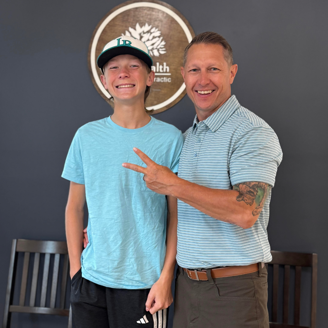 Dr. Andrew Smith with a young athlete at TRU Health Family Chiropractic Downers Grove IL